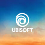 Angajați ai Ubisoft Paris participând la o oprire a lucrului, ținând pancarte și mesaje de protest legate de condițiile de muncă.