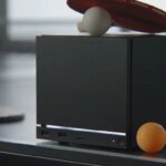 Consolă de gaming Steam Machine, design modern și compact, pentru experiență de gaming PC pe televizor.